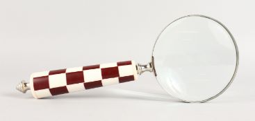 A MAGNIFYING GLASS.