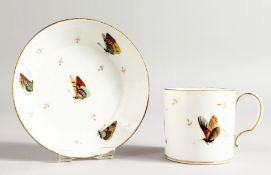 A PARIS PORCELAIN COFFEE CAN AND STAND painted with butterflies and gold sprigs.