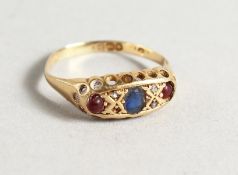 AN 18CT GOLD, RUBY AND SAPPHIRE RING.