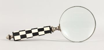 A MAGNIFYING GLASS.