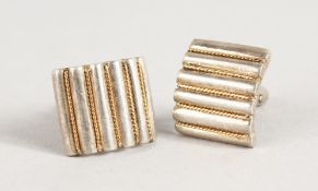 A PAIR OF TIFFANY 18K AND SILVER CUFFLINKS.