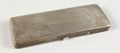 A RECTANGULAR HINGED SILVER BOX containing an early pair of spectacles. 4.75ins long.