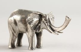 A SOLID SILVER NOVELTY ELEPHANT.