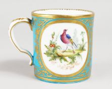 AN 18TH CENTURY SEVRES BLUE CELESTE MUG, painted with two oval landscapes, both containing birds