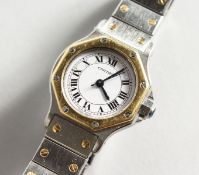 A LADIES CARTIER SILVER AND GOLD WRISTWATCH, No. 090770249, in original box.