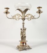 A LARGE VICTORIAN PLATE TABLE CENTREPIECE, with circular cut glass bowl, supported on three