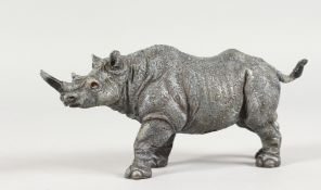 A VIENNA STYLE COLD PAINTED BRONZE OF A RHINO. 6ins long.