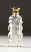 A CUT GLASS SCENT BOTTLE with an 18ct gold top.