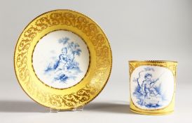 A SEVRES COFFEE CAN AND SAUCER, the can painted in blue with a child fishing, on a yellow ground