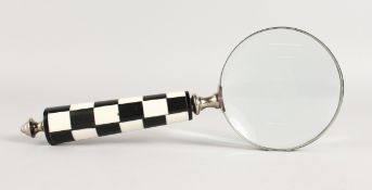 A MAGNIFYING GLASS.