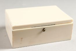 A GOOD SMALL RECTANGULAR IVORY BOX with hinged lid. 4ins long x 2.5ins wide x 1.5ins high.