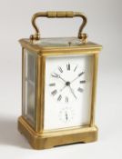 A 19TH CENTURY FRENCH BRASS ALARM REPEAT CARRIAGE CLOCK. 5ins high.