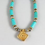 AN ISLAMIC TURQUOISE NECKLACE AND PENDANT.