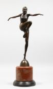 AN ART DECO STYLE BRONZE OF A DANCER on a circular marble base. 22ins high.