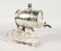 A NOVELTY PLATED LIQUEUR DISPENSER modelled as a bear on a sledge holding up a barrel. 8ins high.