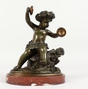 AFTER CLODION (1738-1814) FRENCH A GOOD BRONZE OF A SEATED CUPID playing cymbals, on a circular