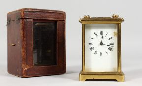 A GOOD FRENCH BRASS CARRIAGE CLOCK. 4.5ins, in a leather case.