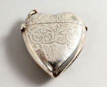 A SILVER HEART SHAPED VESTA.