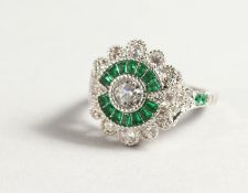 A SILVER FAUX EMERALD DECO STYLE RING.