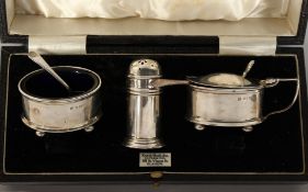 A THREE PIECE SILVER CONDIMENT SET. Birmingham.