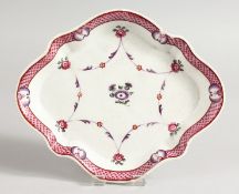 A NEW HALL SHAPED SPOON DISH with pink flowers. 7.25ins long.