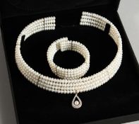 A 9CT GOLD FOUR ROW PEARL CHOKER AND BRACELET.