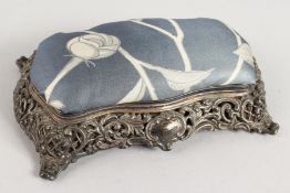 A VICTORIAN PIERCED SILVER PIN CUSHION with padded top and blue silk interior. Birmingham 1896.