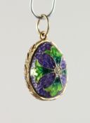 A RUSSIAN SILVER AND ENAMEL MINIATURE EGG SHAPED PENDANT.