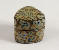 A SMALL ISLAMIC LACQUER PILL BOX.