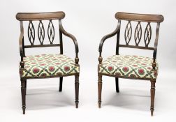A GOOD PAIR OF REGENCY MAHOGANY ARMCHAIRS, with triple pierced oval splats, reeded arms, padded
