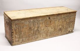 A 17TH CENTURY ITALIAN CARVED PINE CASSONE, the rising top and front carved with stylized vases of