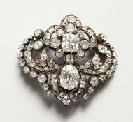 A SUPERB OLD CUT DIAMOND BROOCH of CIRCA 1880, with two large diamonds surrounded by approx.