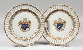 A PAIR OF SAMSON OF PARIS ARMORIAL PLATES with pierced borders. 9.75ins diameter.