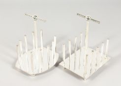 TWO CHRISTOPHER DRESSER STYLE TOAST RACKS.