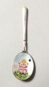 A SMALL SILVER AND ENAMEL SPOON. 4.25ins long.