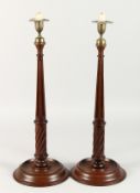 A PAIR OF TURNED WOOD AND FLUTED GEORGIAN STYLE CANDLESTICKS.