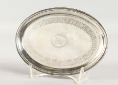 A SILVER OVAL TEAPOT STAND, with engraved decoration, on four curving feet. London 1805. 6.5ins