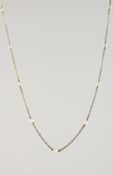 A DELICATE GOLD AND PEARL NECKLACE.