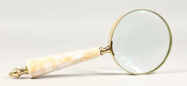 A MAGNIFYING GLASS with mother-of-pearl handle.