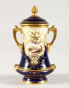 A COALPORT MINIATURE TWO-HANDLED URN AND COVER. 4.5ins high.