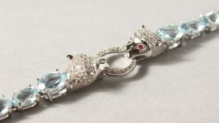 A SILVER BLUE TOPAZ CARTIER STYLE LINE BRACELET.