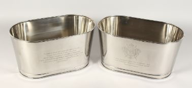 A PAIR OF SMALL PLATED OVAL WINE COOLERS. 13.5ins long.