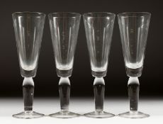 FOUR HEAVY TALL ALE GLASSES.