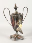 A GEORGE III TWO HANDLED TEA URN AND COVER with reeded handles and pineapple finial, square shaped