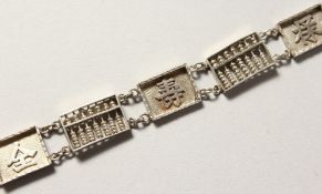 A CHINESE SILVER BANGLE.