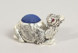 A SILVER PLATE CAMEL PIN CUSHION.