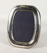 A CARRS SILVER OVAL PLAIN SHAPED PHOTOGRAPH FRAME. 9.5ins x 7ins.