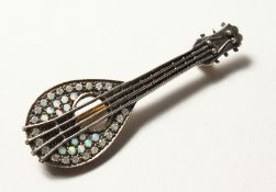 A 9CT GOLD AND SILVER, OPAL AND DIAMOND SET MANDOLIN BROOCH.