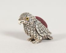 A CAST SILVER PARROT PIN CUSHION.