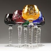 SIX HARLEQUIN COLOURED CUT CRYSTAL HOCK GLASSES.